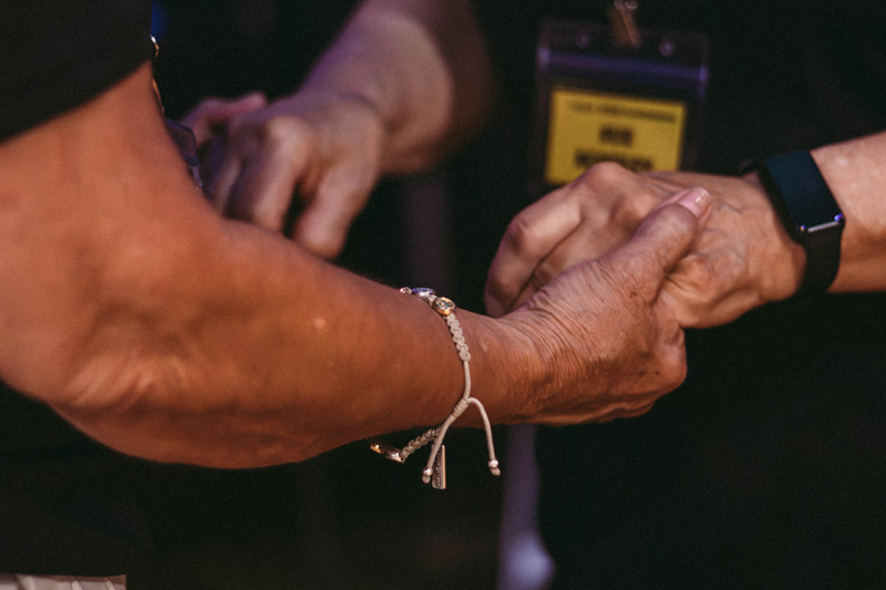 Holding hands in prayer.
